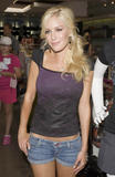 Heidi Montag leggy and busty in denim shorts and tight purple top arrives at Kitson on Robertson Blvd in Beverly Hills to help boost the Heidiwood clothing label at the popular designer store